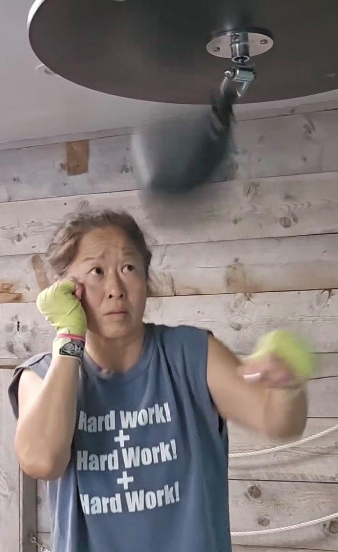 motivational fitness influencer boxing and wearing a custom t-shirt